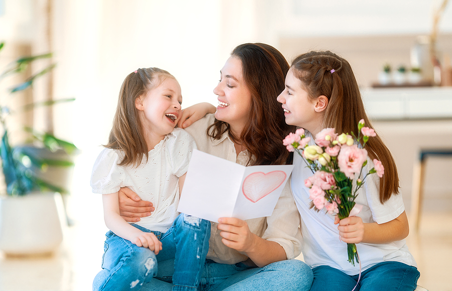 mom with two young daughters on Mother's Day