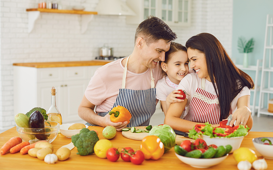 family cooking healthy in kitchen