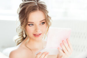 beautiful young bride looking in mirror