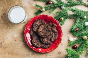 red plate with chocolate chocolate chip cookies