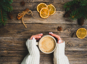 woman's hands holding cup of hot chocolate