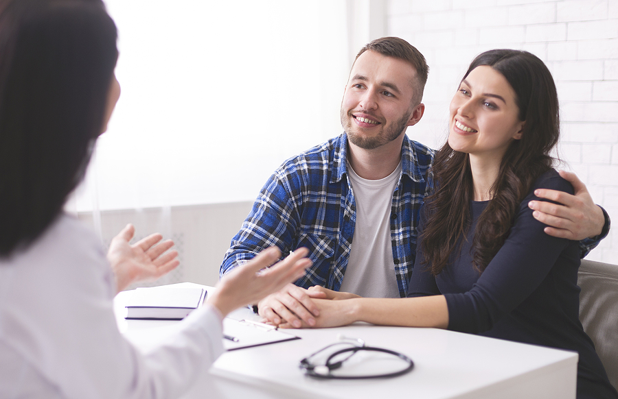 young couple with doctor